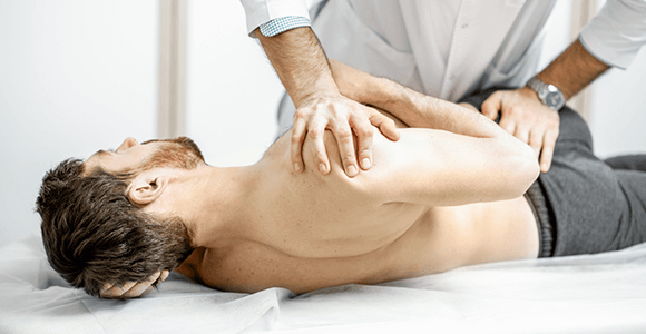 Image showing clinician giving manual treatment to patient with shoulder pain