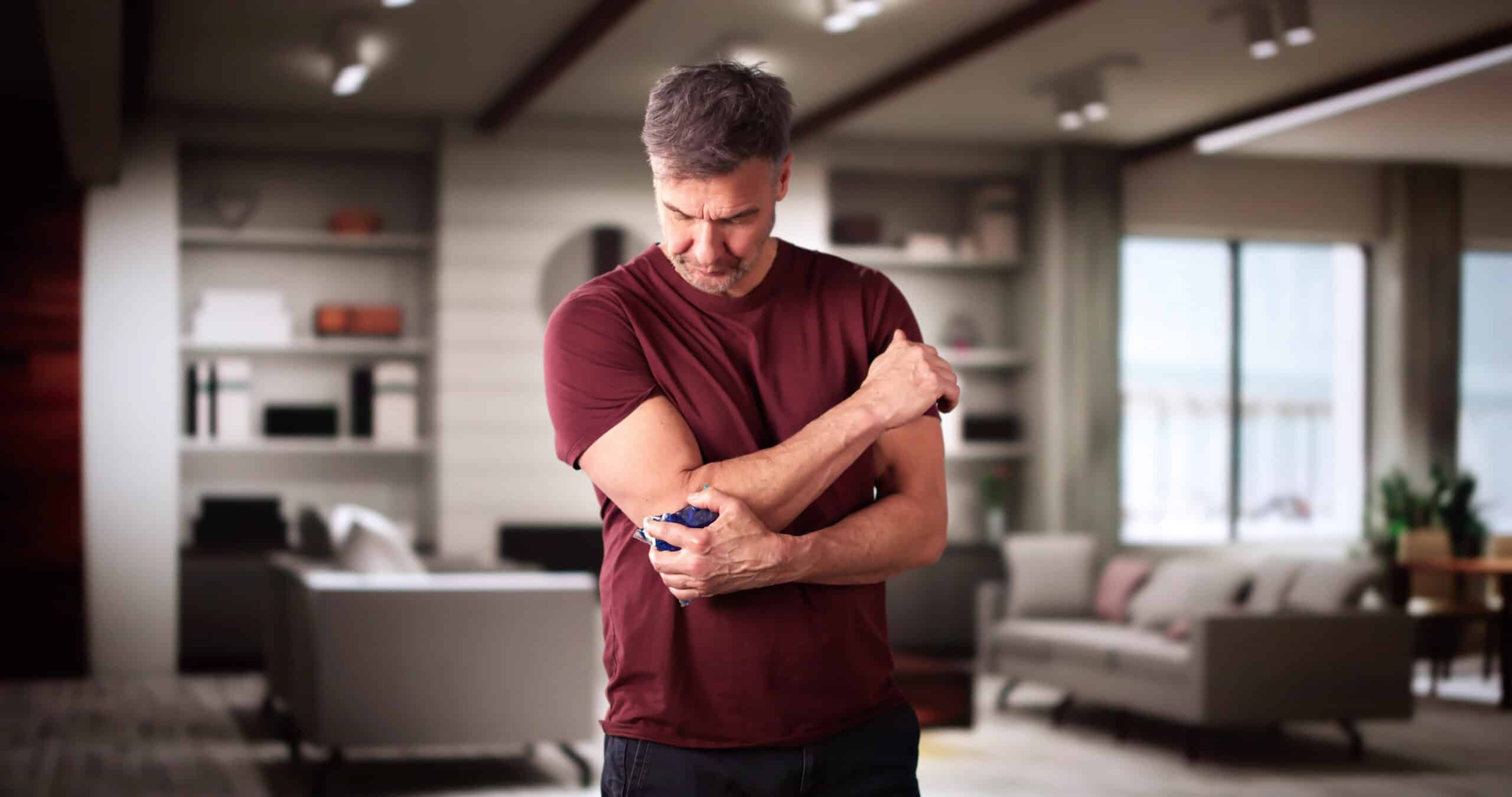 image of person in pain due to tennis elbow